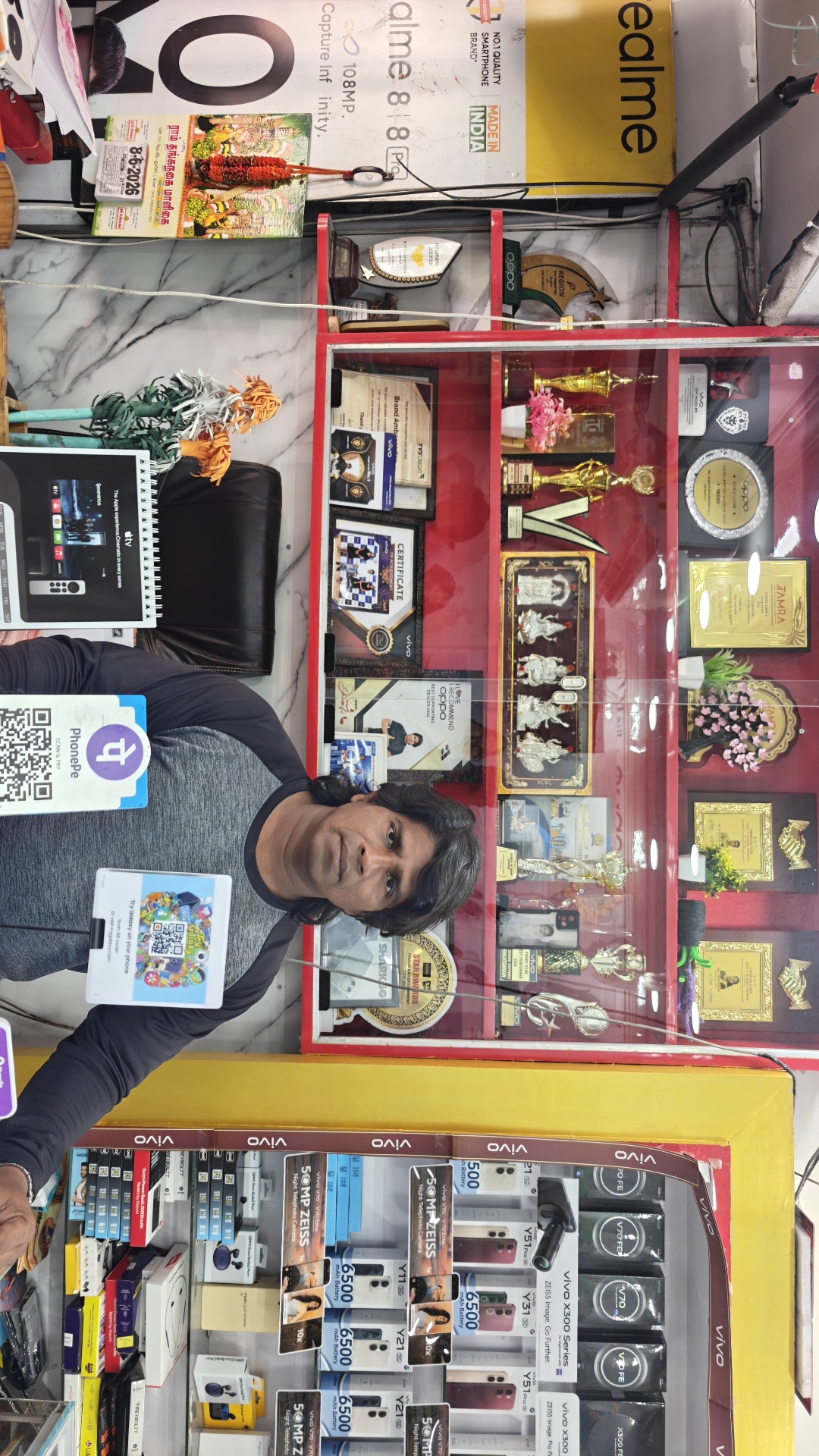 Owner at the SIM Mobiles counter